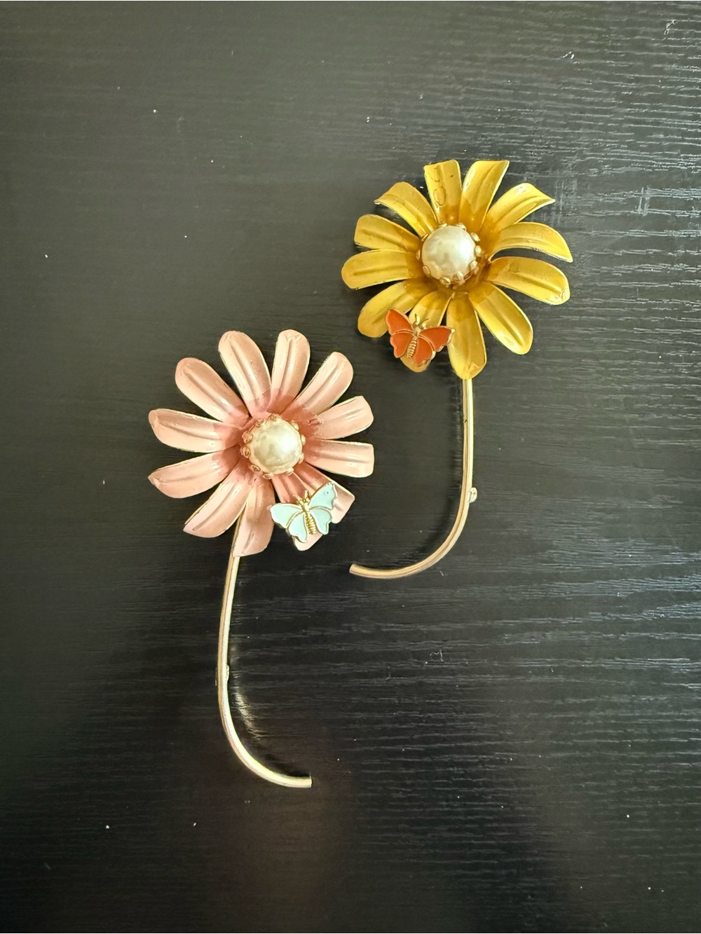 Vintage 1960s costume jewelry pieces. Pink & yellow floral brooches.